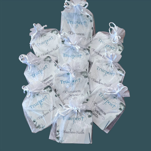 10 sets of the mini scripture card sets on a teal background.