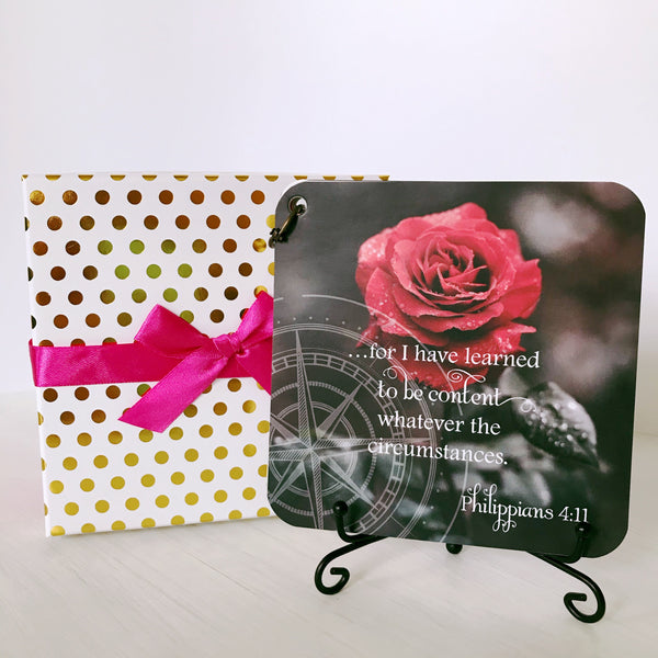 Gift box,  scripture devotional card set sitting on the black iron easel.