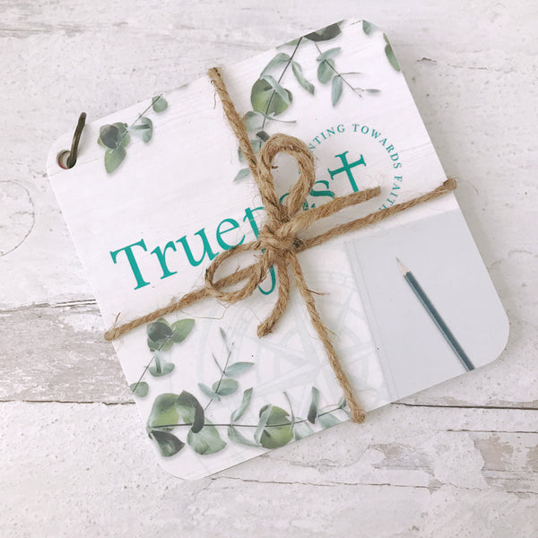 Scripture devotional cards beautifully wrapped with natural jute twine, that's  tied in a bow, for a charming rustic vibe.