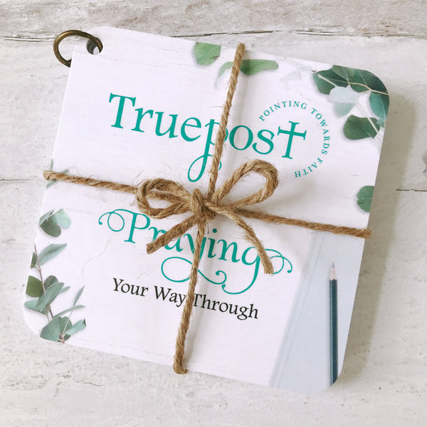Scripture devotional cards beautifully wrapped with natural jute twine, that's  tied in a bow, for a charming rustic vibe.