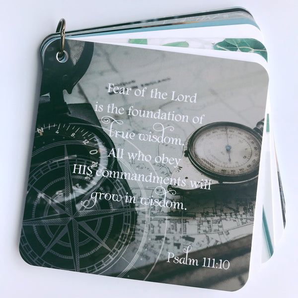 Scripture card on loss from Psalm 111:10 is printed over a photo of a map and a compass.