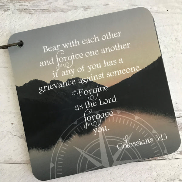 Scripture card of Colossians 3:13 printed over a photo of a lake and mountains.