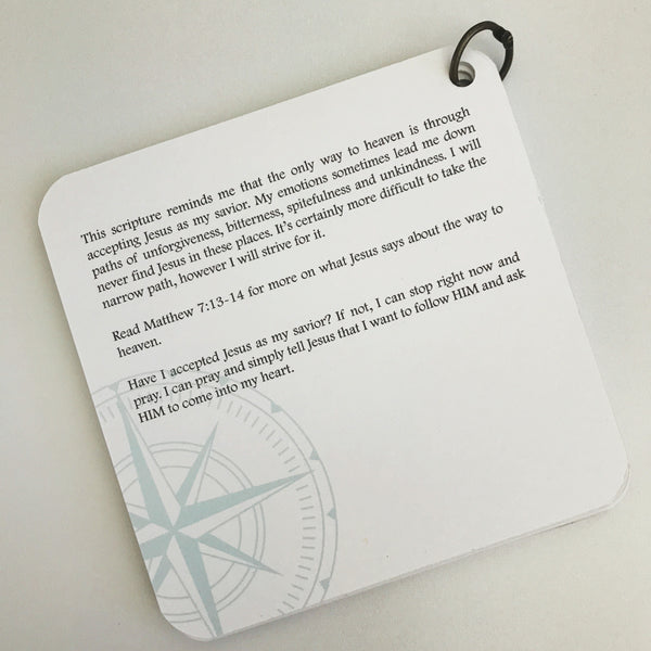 Devotion printed over a turquoise colored compass.