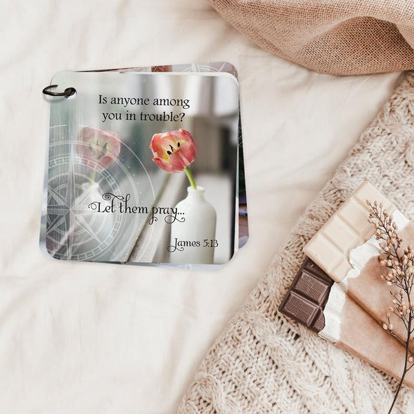 Scripture card for James 5:13 printed over a photo of a flower in a vase and a compass in the left corner.