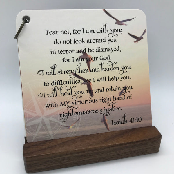 A beautiful scripture card with the scripture of Isaiah 41:10 printed over a stunning  photograph  of birds flying over the water at sunset.