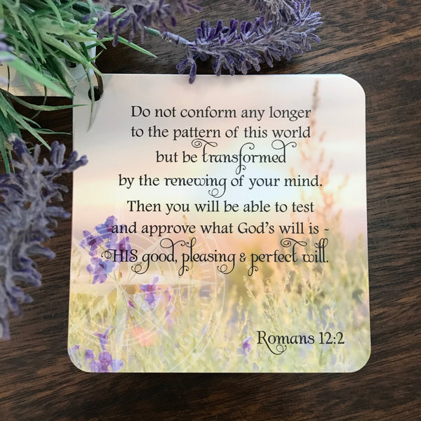 A scripture card with the scripture from Romans 12:2 printed over a beautiful photograph of Texas blue bonnets.