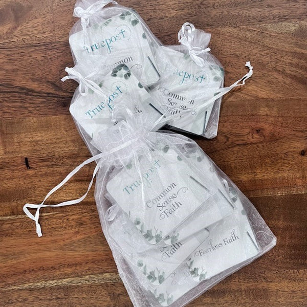 10 sets of 10 mini scripture cards in the white organza bag they come in.