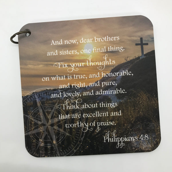 Cross on a hill with sun shining over the ocean and seaoats. Philippians 4:8 printed over photo. Daily scripture card.