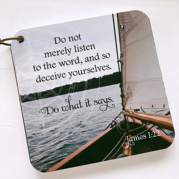 Scripture card of James 1:22 printed over a full color photo of a sailboat's sail & front section of the boat on the water.