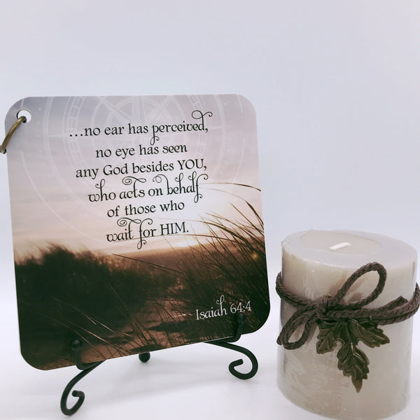 Scripture card of Isaiah 64:4 printed over a color photo of a beach scene. The cards are displayed on a black iron easel next to a candle.