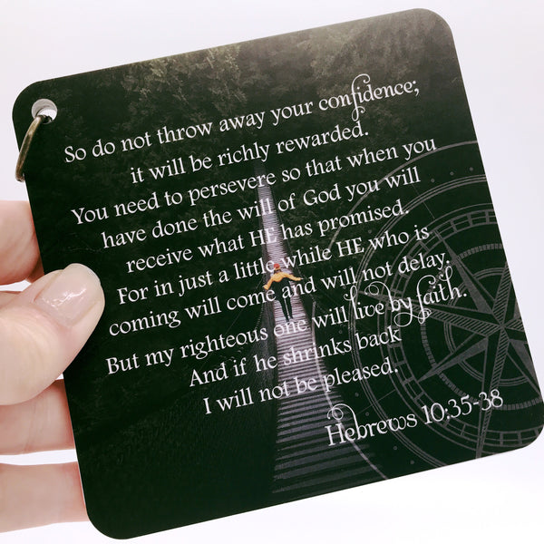 Scripture card of Hebrews 10:35-38 printed over a photo pf someone walking over a long suspended bridge. Daily scripture card.