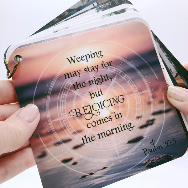 Scripture card of Psalm 30:5 printed on a full color photo of the edge of an ocean with the sunset in the background.