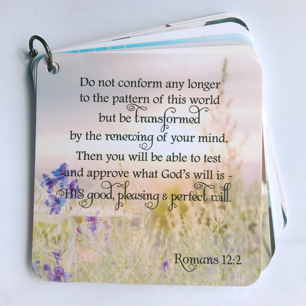 Scripture card of anxiety from Romans 12:2 printed over a field of purple flowers. Daily Bible verse card.