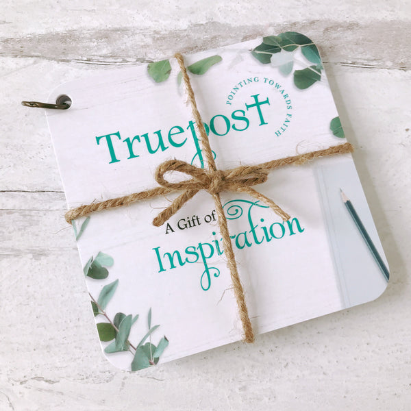 Scripture devotional cards beautifully wrapped with natural jute twine, that's  tied in a bow, for a charming rustic vibe. Bible verse gift idea.