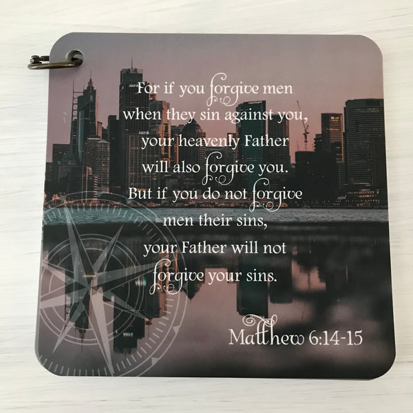 Scripture card of Matthew 6:14-15 printed over a photo of a cityscape next to the water. Daily Bible verse card.