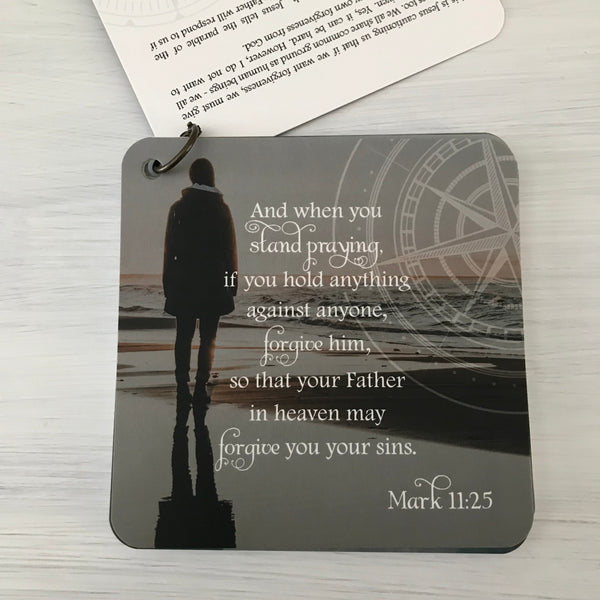 Scripture card of Mark 11:25 printed over a photo of a women in a jacket standing at the edge of the water with lapping waves. Daily scripture card.