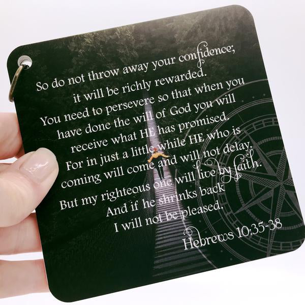 Scripture card of Hebrews 10:35-38 printed over a photo pf someone walking over a long suspended bridge.