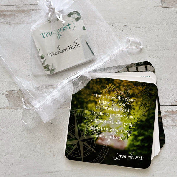 Scripture card with Jeremiah 29:11 next to the mini motivators mini scripture card set in a white organza bag.