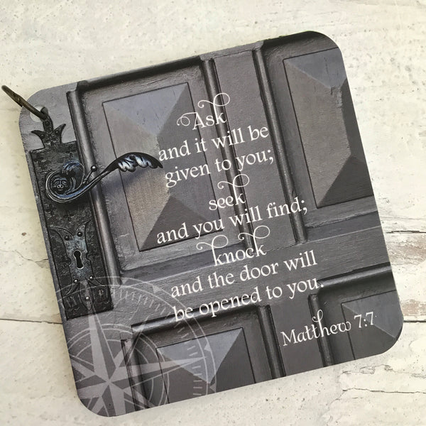 Scripture card of Matthew 7:7 printed over the photo of an old grey door.