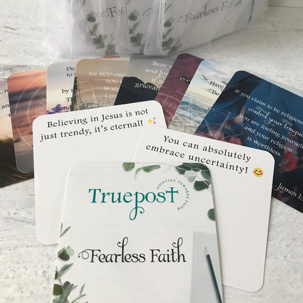 Fearless faith mini scripture cards fanned out with 4 packaged sets in the background.