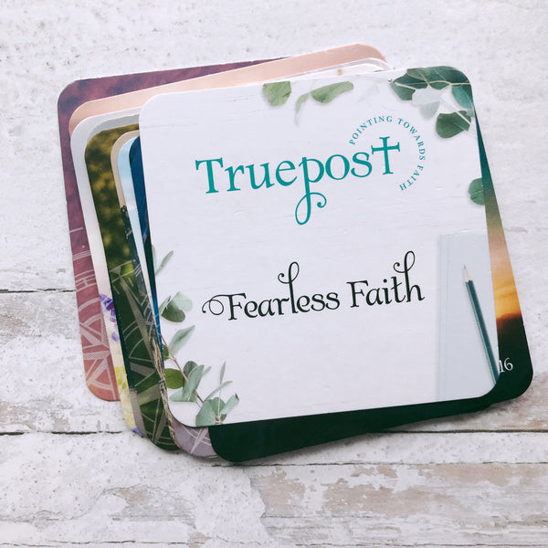 A set of minis scripture cards called Fearless Faith fanned out on a white destressed background.