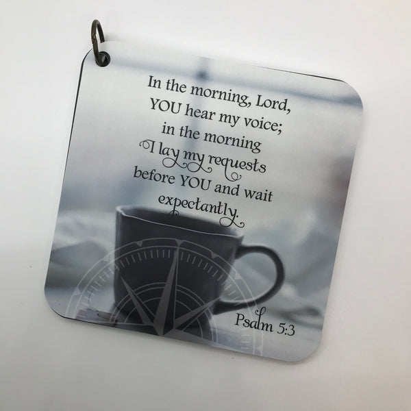 Scripture card of Psalm 5:3 in the morning Lord you hear my voice printed over a photo of a cup of coffee. Compass across the bottom.