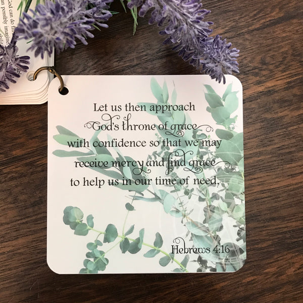 Scripture card of Hebrews 4:16 printed over a photo of eucalyptus stems. 